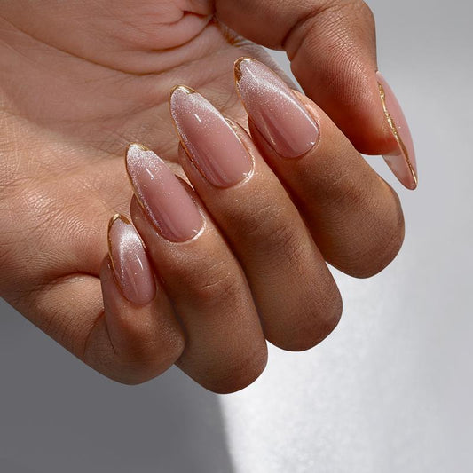Close-up of a hand with pink nail polish on a neutral background