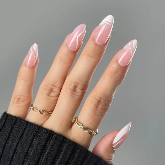 Hand with pink and white marbled nail polish on a gray background